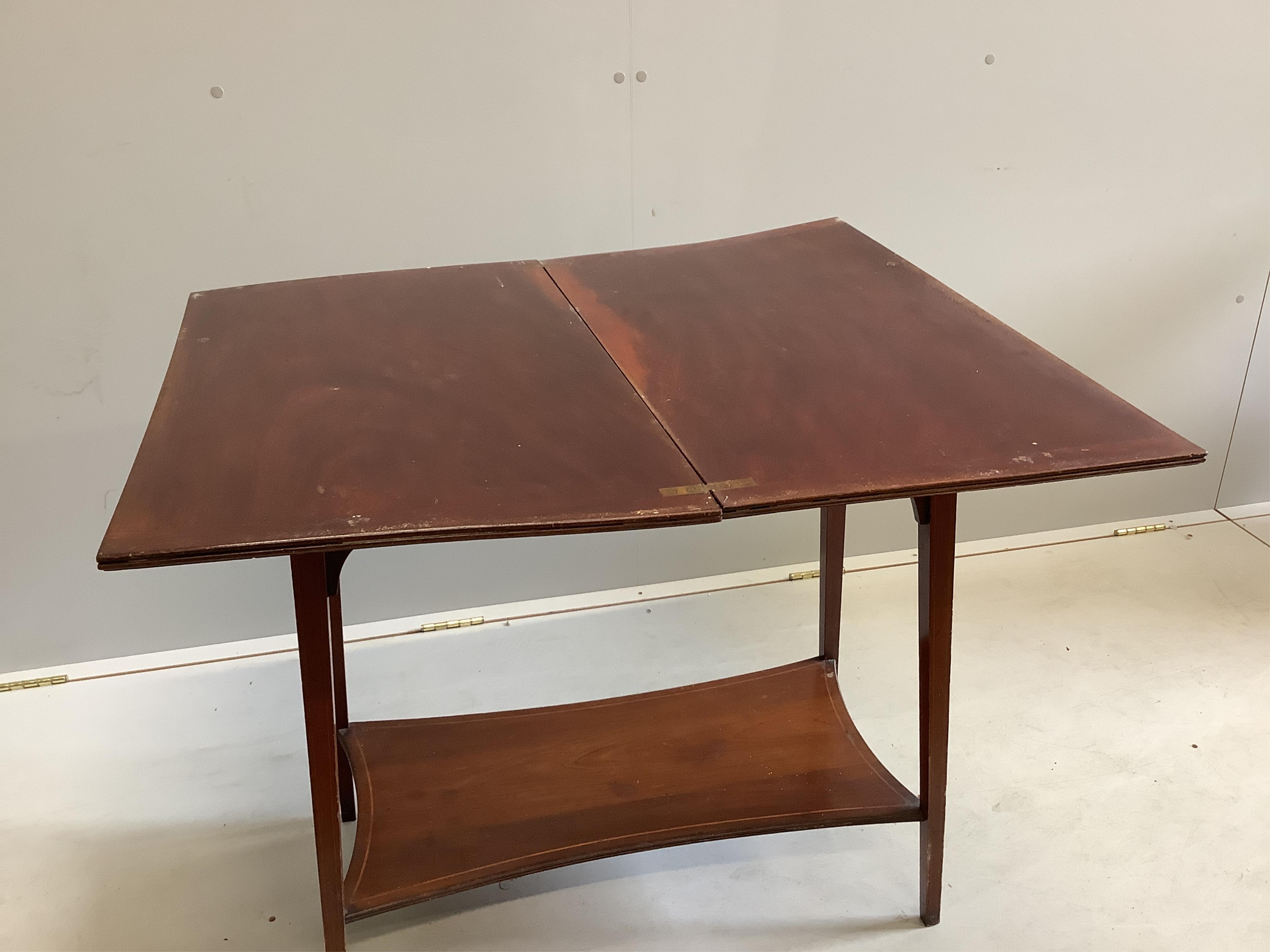 An Edwardian satinwood banded mahogany rectangular folding tea table, width 75cm, depth 42cm, height 73cm. Condition - poor